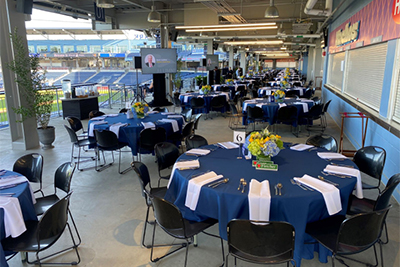 Banquet Tables and Chairs with Blue Tablecloths on Main Concourse at Polar Park