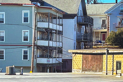 Three-Decker Apartments on City Street Looking at Back Porch Area