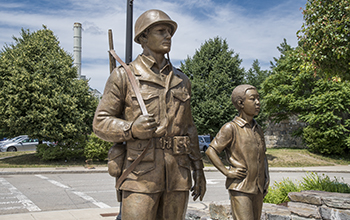 Bronze Statue of American Soldier and Korean Child at the Korean War Memorial
