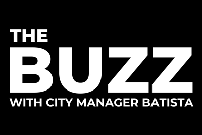 The Buzz with City Manager Batista White Text on Black Background