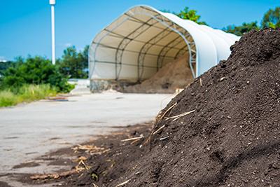 Compost Mound at the Residential Drop Off Center in Front of Winter Sand Pile