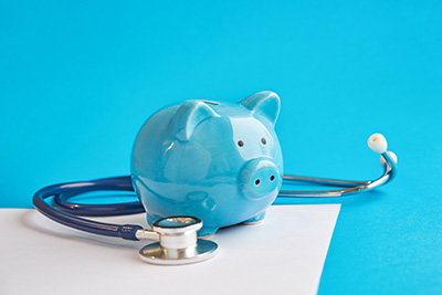 Light Blue Piggy Bank and Stethoscope