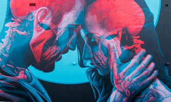 Blue and Red Mural on Brick Wall of Couple Embracing